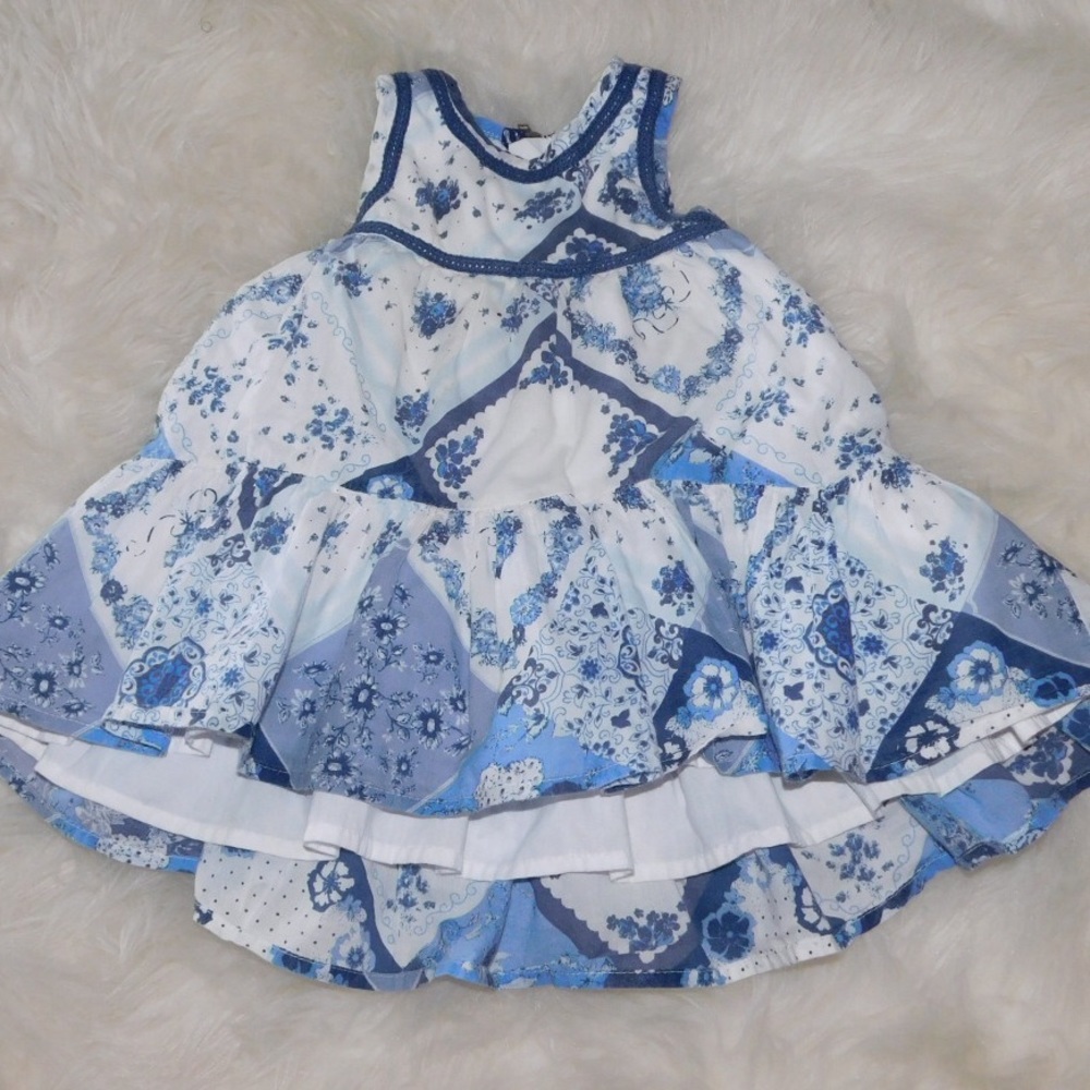 Flared; High-Low racer back dress.